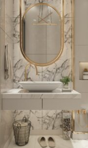 Gold framed oval Houston residential mirrors in marble bathroom